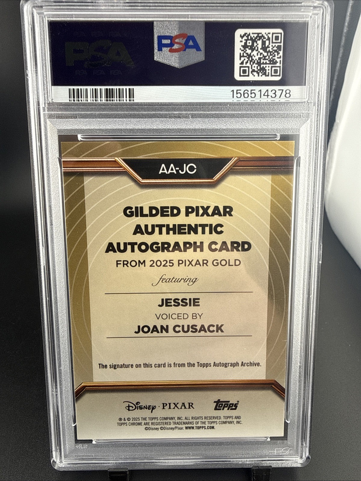 🔥2025 Topps Pixar Gold Joan Cusack as Jessie Gilded Auto #AA-JC /10