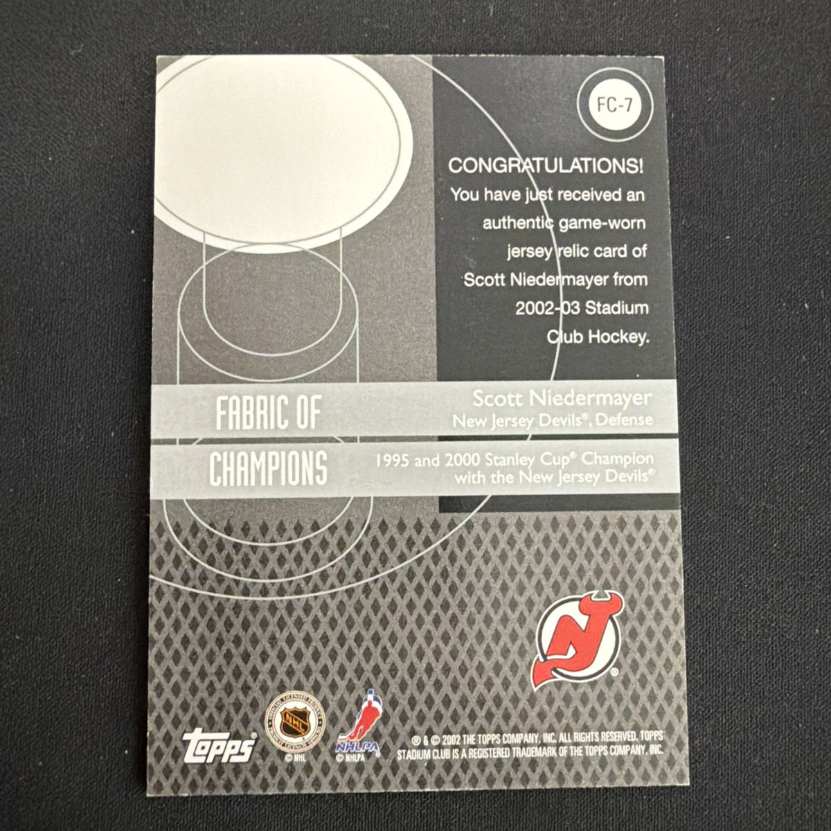 2002-03 Topps Stadium Club - Fabric of Champions Scott Niedermayer #FC-7 (MEM)