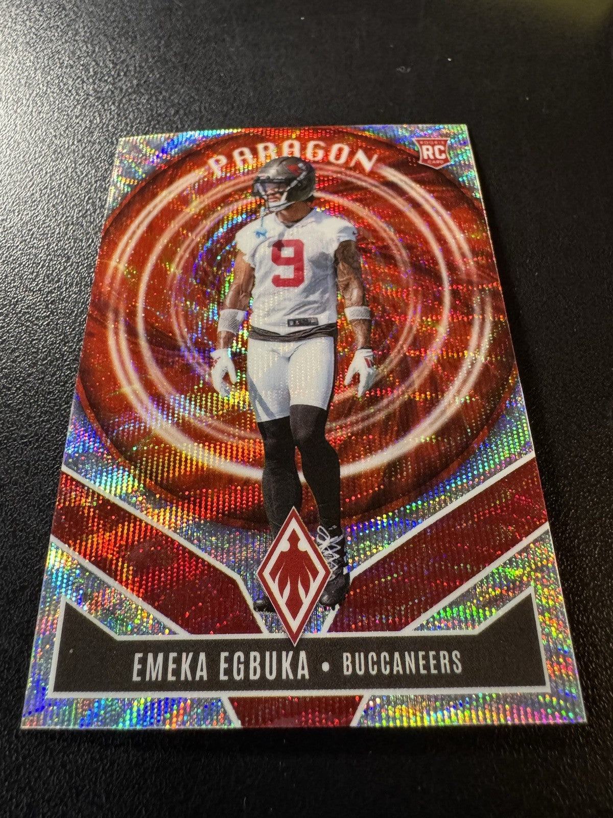 2025 Panini Phoenix Emeka Egbuka Silver Wave Paragon /299 RC Buccaneers